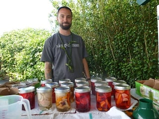 Chef_Noah_Hester_in_Malaai_garden_2015-HSG_w__pickled_veggies.jpg