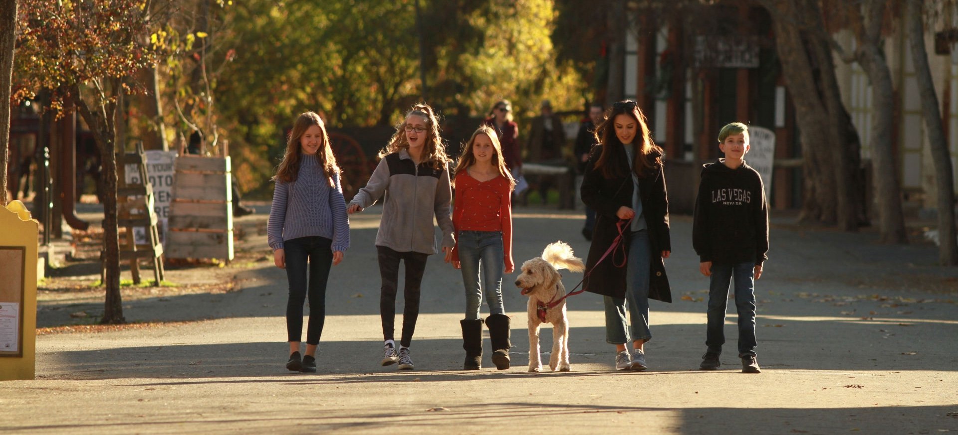 family walking dog